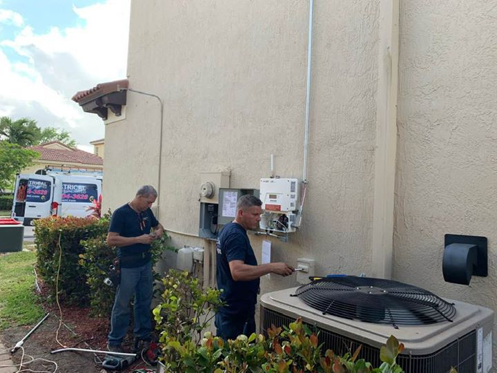 Electrician running new electrical wiring in a Miami home